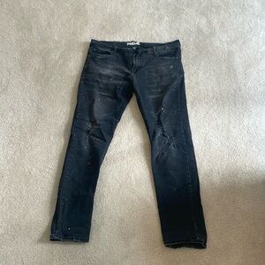 Men’s paint splattered black jeans